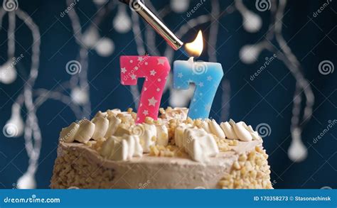 Birthday Cake With 77 Number Pink Candle On Blue Backgraund Candles