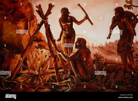 A Picture Of Ancient People Using Fire For Cooking During Cave Days