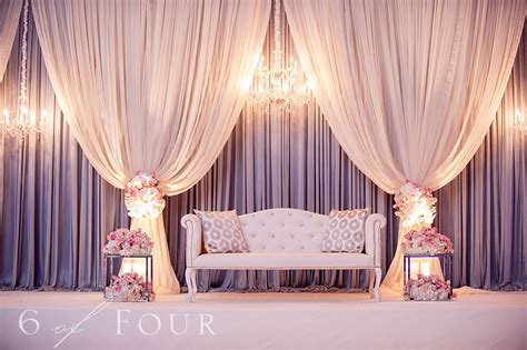 indian wedding reception decor couch  front  stage  drapes