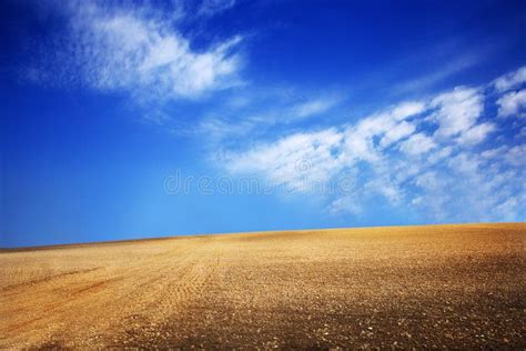 Field With Ground And Blue Sky With Clouds On The Farm In Beautiful