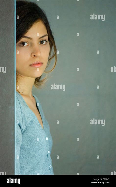 Young Woman Leaning Against Wall Portrait Stock Photo Alamy