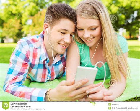 Smiling Couple In Park Stock Image Image Of Music Modern 42864707