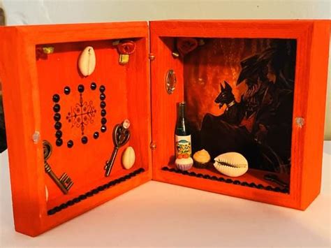 An Open Orange Box With Various Items Inside