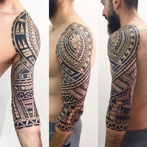 A Man S Arm And Shoulder With An Intricate Tattoo Design On The Upper Half