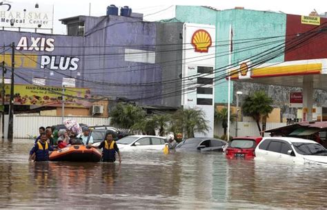 Nine Dead After Indonesian Capital Hit By New Year Flooding