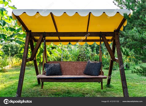 Large Wooden Swing Canopy House Stock Photo by ©DmytroTomson 412101132