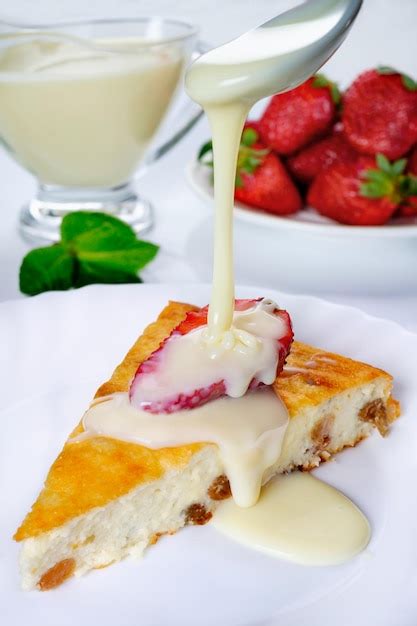 Premium Photo | Cheesecake with strawberries, condensed milk and mint