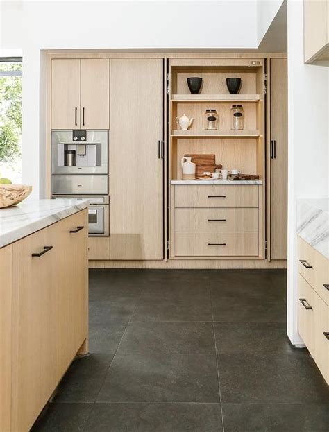 Modern Tan Oak Kitchen Cabinets With Black Grid Floor