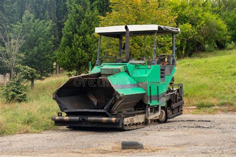 Asphalt Paver Machine. Asphalt Finisher or Paving Machine Placing a ...