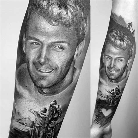 A Man S Arm With Two Pictures On It