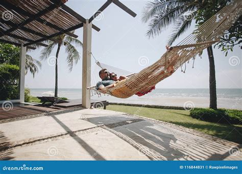 Couple Sleeping Outdoors Together On Hammock Stock Image Image Of