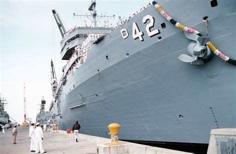 Crew Members Stand At The Railing Aboard The Destroyer Tender Uss