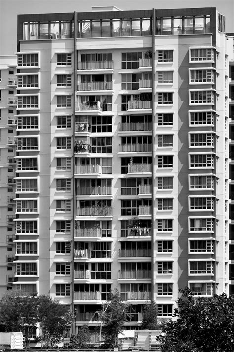 A Very Tall Building With Lots Of Windows Photo Free Grey Image On Unsplash