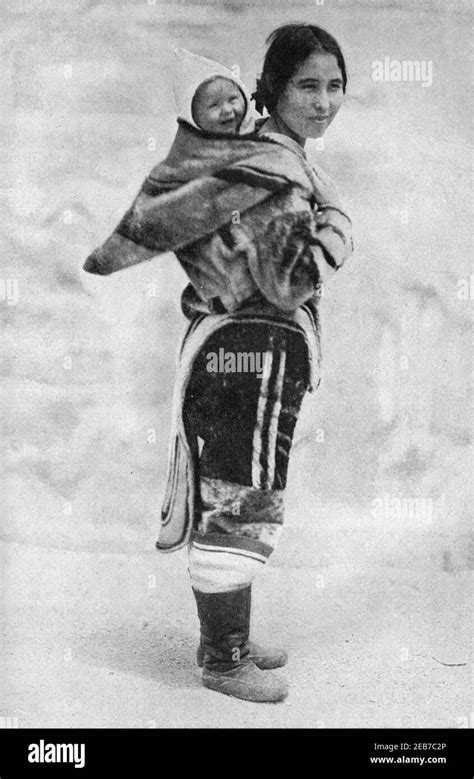 An Early 20th Century Photo Of A Young Labrador Inuit Woman Carrying