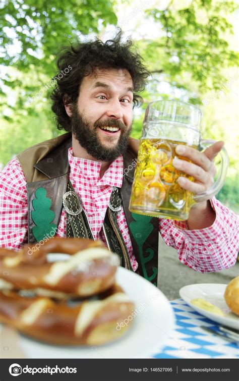 Bavarian Bearded Guy In A Beer Garden Saying Cheers Prost With Beer