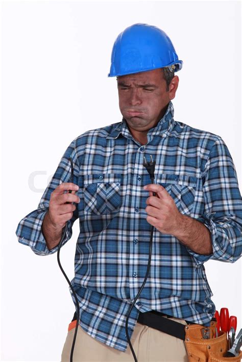 Untrained electrician getting a shock | Stock image | Colourbox