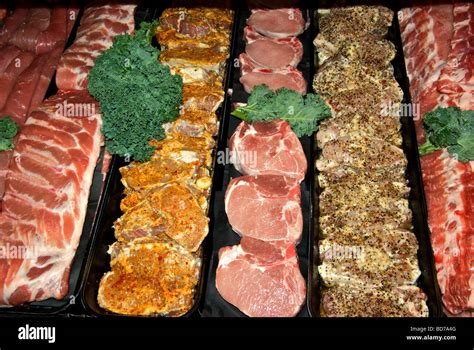 Meat Display Cooler Case With Raw Uncooked Pork Products Chops Spare