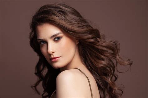 Premium Photo Portrait Of Cute Woman Brunette With Dark Blowing Curly Hairstyle