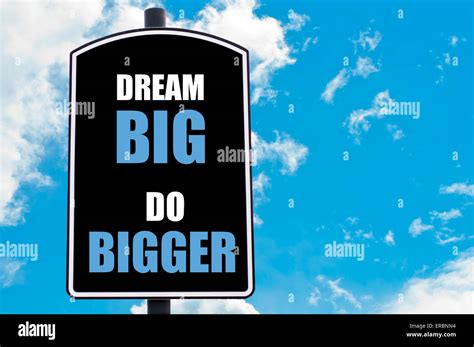 Dream Big Do Bigger Motivational Quote Written On Road Sign Isolated