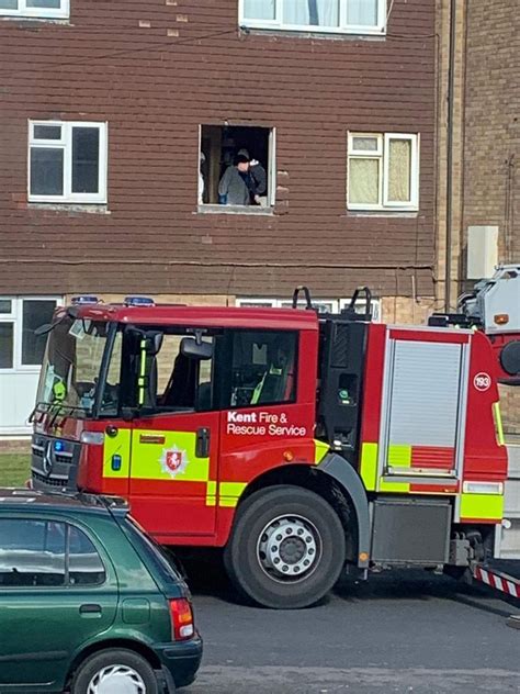 Pictures Show Paramedics In Hazmat Suits Lifting Patient Through Window