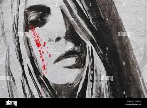 Street Art in Paris representing a sad woman crying blood Stock Photo ...