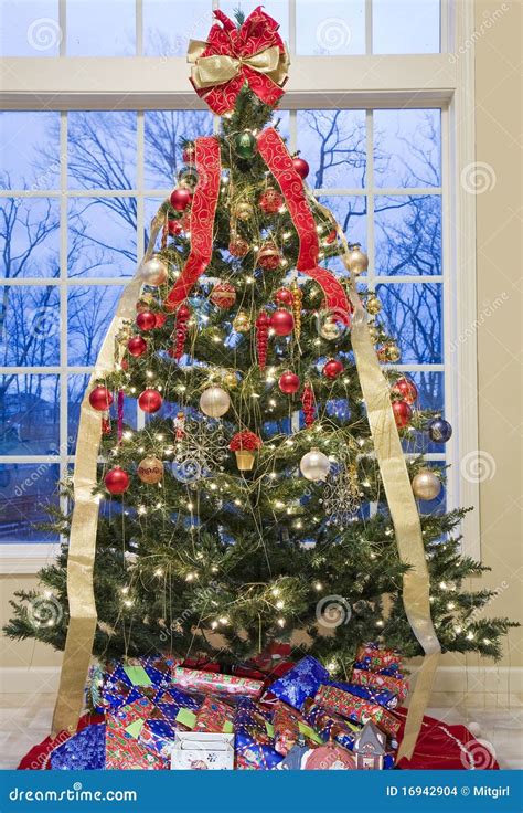 Beautifully Decorated Christmas Tree By A Window Stock Photo Image Of