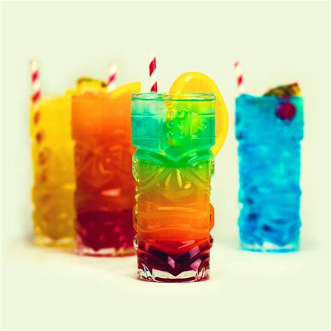 A Fun Set Of Tiki Head Cocktail Glasses That Lend A Tropical Feel To Any Drink