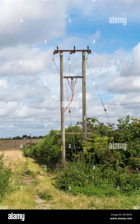 Overhead Electric Power Distribution Wires On Poles Stock Photo Alamy