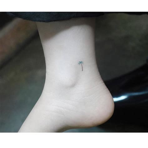 Tiny Palm Tree Tattoo Located On The Ankle