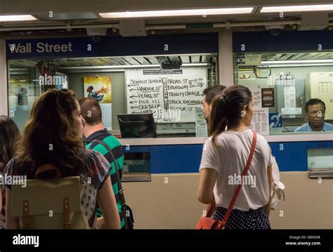 A Token Booth At The Wall Street Station In New York Displays A Sign