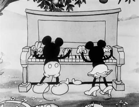 mickey and minnie mouse playing the piano together