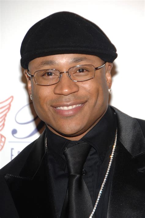 Download American Rapper LL Cool J with signature Gold Ring Wallpaper