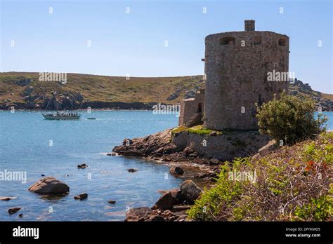 A Yacht In New Grimsby Sound Sails Past Cromwells Castle On Tresco