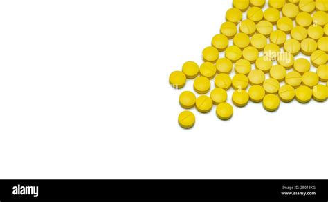 Yellow Small Round Tablets Pills On White Background Healthcare