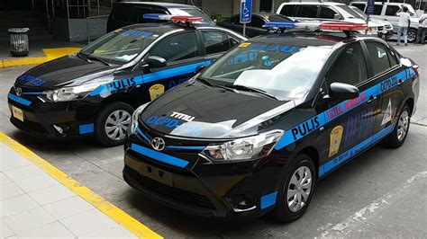 Quezon City Police District And A Tactical Motorized Unit Police Cars