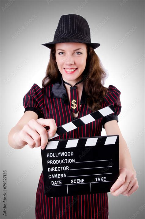 Woman gangster with movie board on white Stock Photo | Adobe Stock