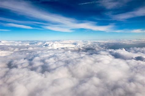 Premium Photo Blue Sky Above A Layer Of White Clouds