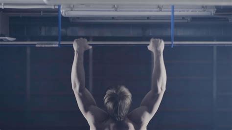 Premium Photo Back View Of Muscular Man With Naked Torso Doing Pull Ups Exercise On Horizontal