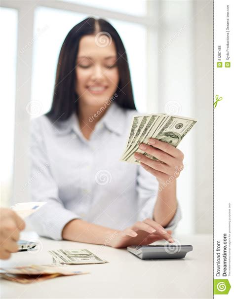 Close Up Of Woman Counting Money With Calculator Stock Photo Image Of