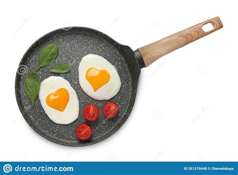 Frying Pan With Tasty Fried Eggs With Yolks In Shape Of Heart And Tomato On White Background