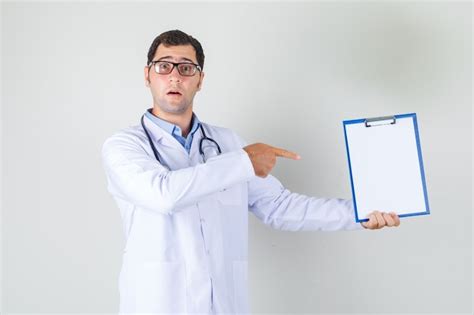 Free Photo Male Doctor In White Coat Glasses Pointing Finger At