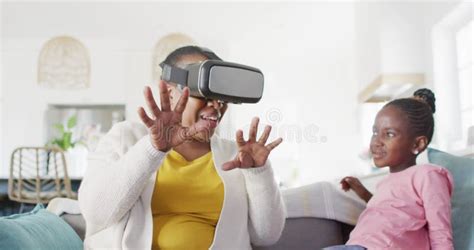 Excited African American Grandmother Using Vr Headset Sitting With