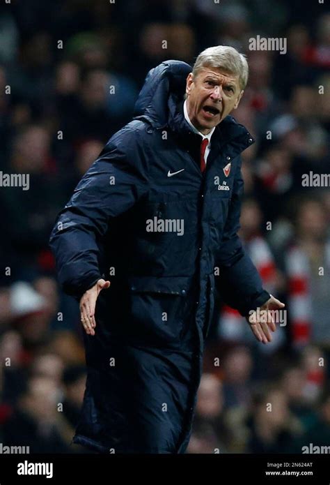 Arsenals Manager Arsene Wenger Gestures To The Fourth Official About A