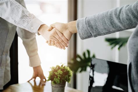 Businesswoman Handshake For Teamwork Of Business Merger And Acquisition