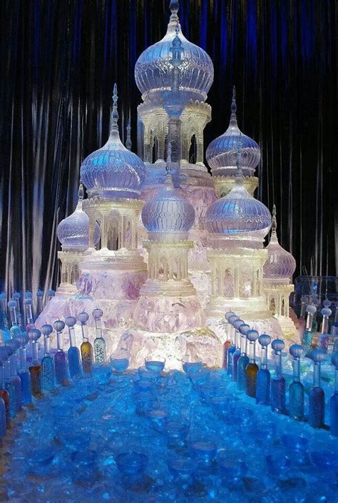 An Elaborate Ice Sculpture In The Shape Of A Castle With Lights And