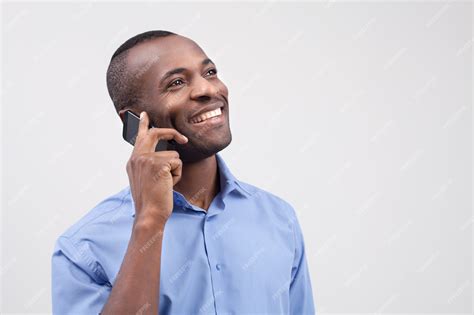 Premium Photo Man On The Phone Cheerful Black Man Talking On The Mobile Phone And Smiling