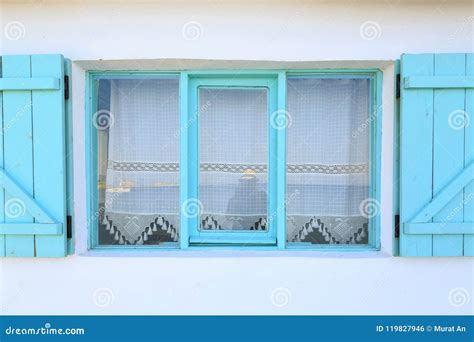 Turquoise Framed Windows On White Wall With Curtains In Datca T Stock