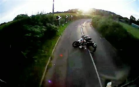 Moment Motorcyclist Survives Crashing Into Lorry After Hitting Pothole