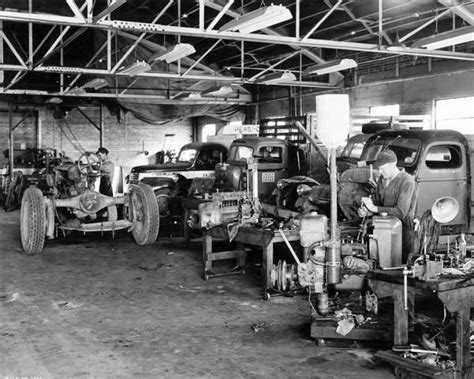 Mechanics At Work Inside International Harvester Service Shop