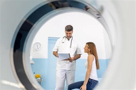 Premium Photo Male Doctor Giving Information To Woman Before Mri Scan